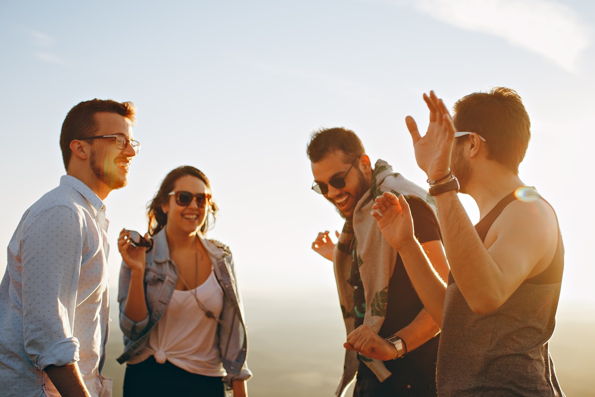A group of friends laughing together outdoors