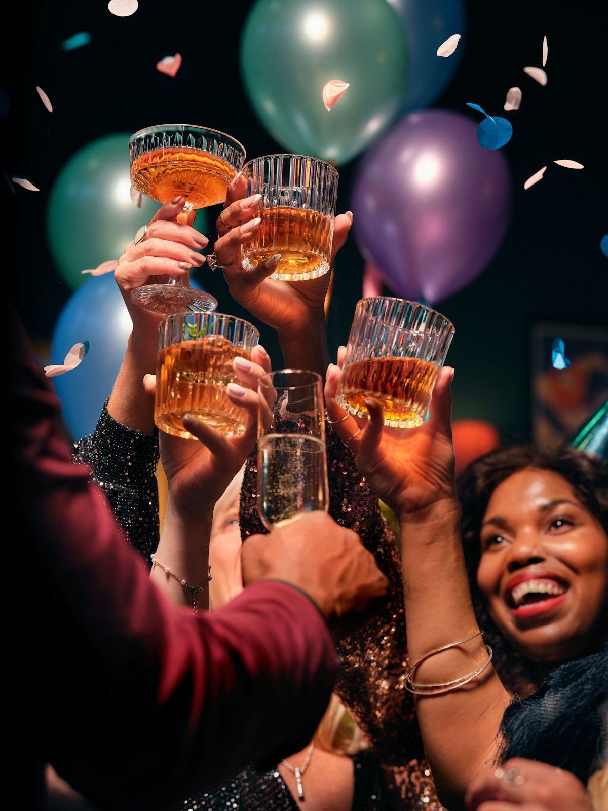 Friends raising glasses in a toast at a celebration